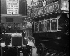 Buses Driving by in London, 1922. Creator: British Pathe Ltd.