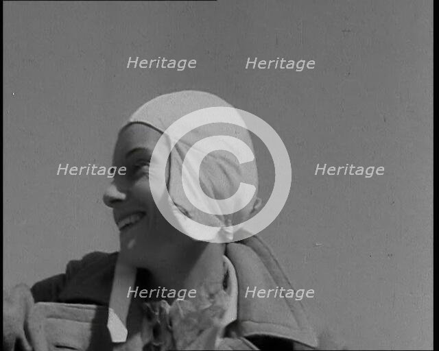 Jean Batten in Flying Gear Smiling to Crowds, 1930s. Creator: British Pathe Ltd.
