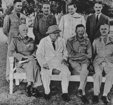 'At the Front in Egypt: Mr. Churchill in Cairo with members of the Middle East War Council', 1942. Artist: Unknown.