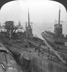 German submarines secured in a Channel port, c1918-c1919. Artist: Realistic Travels Publishers