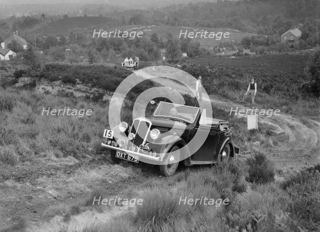 1937 Standard Twelve open 4-seater taking part in the NWLMC Lawrence Cup Trial, 1937. Artist: Bill Brunell.