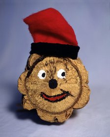 Tió de Nadal' (Christmas log) with barretina (typical Catalan hat).