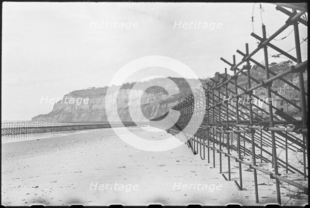 View looking south along the beach at Shanklin, showing Admiralty scaffolding, Isle Of Wight, 1945. Creator: George R Long.