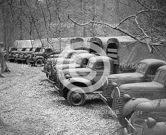 American Military Vehicles Lined up in the Woods Ready for the Opening of a Second Front, 1943-1944. Creator: British Pathe Ltd.