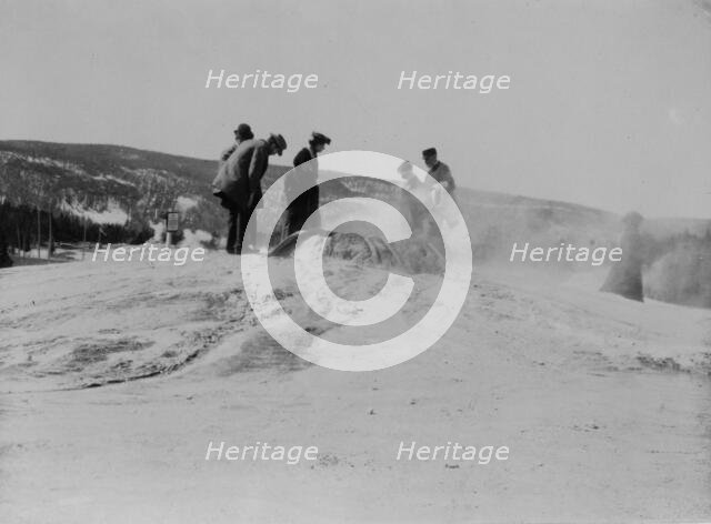 A group of tourists explore a geyser in the Upper Geyser Basin in Yellowstone National Park, 1903. Creator: Frances Benjamin Johnston.