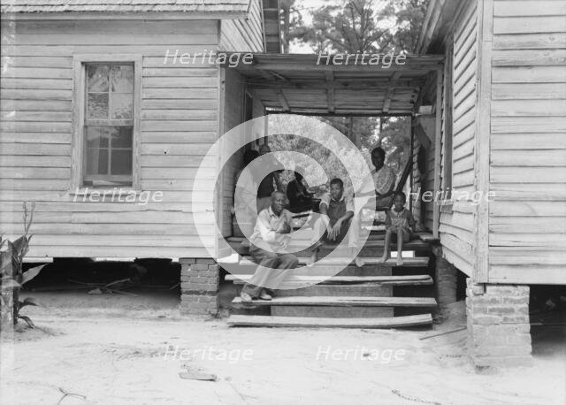 Zollie Lyons, Negro sharecropper, home from the field for dinner..., Upchurch, North Carolina, 1939. Creator: Dorothea Lange.