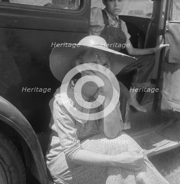 Wife of sharecropper in town to sell their crop at the tobacco auction, Douglas, Georgia, 1938. Creator: Dorothea Lange.