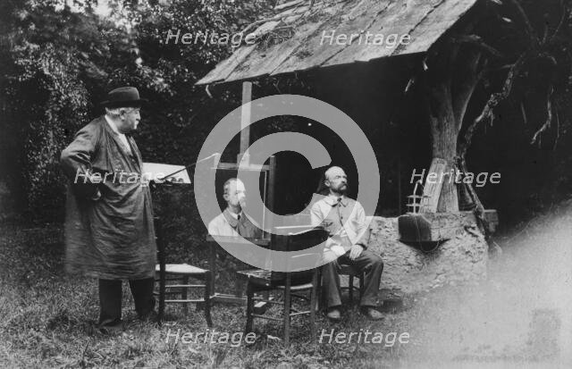 Antoine Lumière painting portrait of posing man, 1905. Creator: Frances Benjamin Johnston.