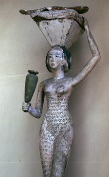 Egyptian statuette of a woman bearing offerings, 22nd century BC. Artist: Unknown