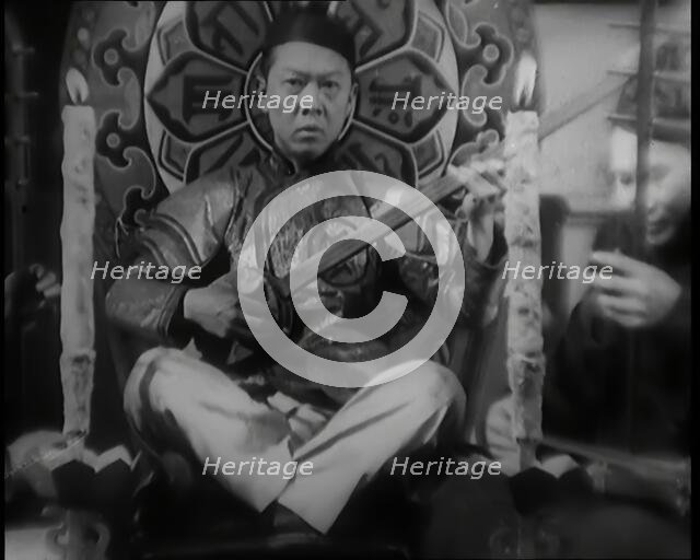 Scene from the Film 'Piccadilly': Male Actor Playing a Lute, 1920s. Creator: British Pathe Ltd.