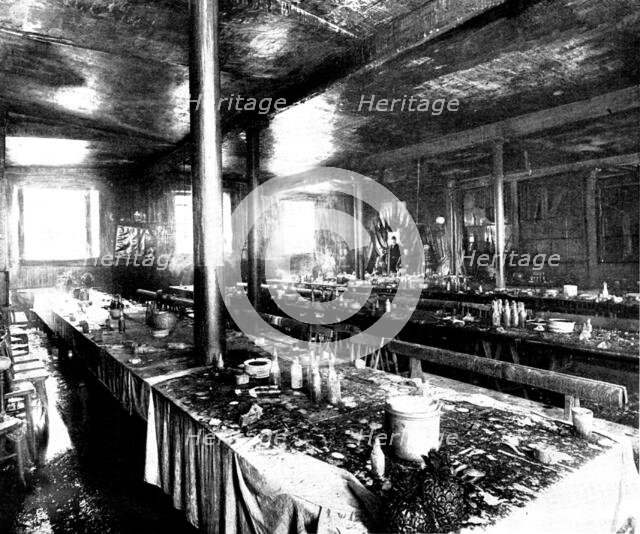 The Destruction of Spurgeon's Tabernacle: remains of the supper preparations, lecture-hall, 1898. Creator: Thiele & Co.