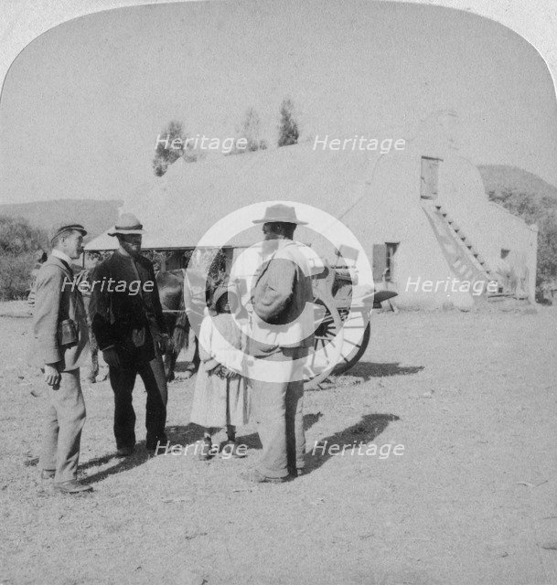 Intervewing a Boer farmer at his home near Brandfort, South Africa, Boer War, 1901.Artist: Underwood & Underwood