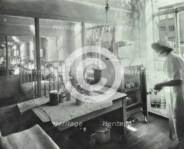 A baby in an isolation unit, Hither Green Hospital, London, 1947. Artist: Unknown.