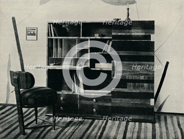 'Bookcase and Chair. Designed and executed by Hans Hartl', c1927. Artist: Unknown.