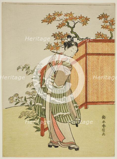 Young Man Playing the Flute Beside a Fence, c. 1767. Creator: Suzuki Harunobu.