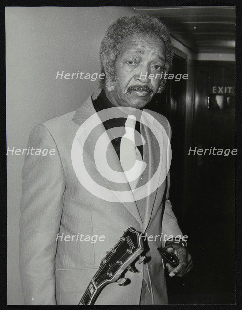 Freddie Green, guitarist with Count Basie's Orchestra, at the Royal Festival Hall, London, 1980. Artist: Denis Williams