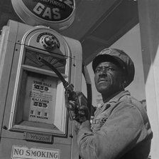 Negro mechanic for the Amoco oil company, Washington, D.C., 1942. Creator: Gordon Parks.