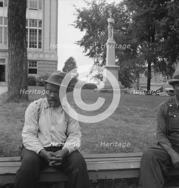 Men idling around the courthouse square, Roxboro, North Carolina, 1939. Creator: Dorothea Lange.