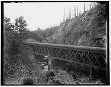 Montreal River, bridge at rock cut, Wisconsin, between 1880 and 1899. Creator: Unknown.
