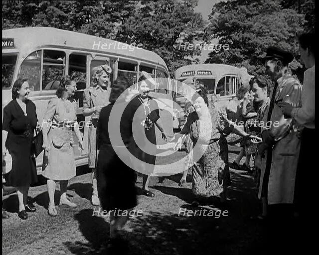 A Group of British Women Dancing On a Grass Verge in the Sunshine With Two Buses Parked..., 1938. Creator: British Pathe Ltd.