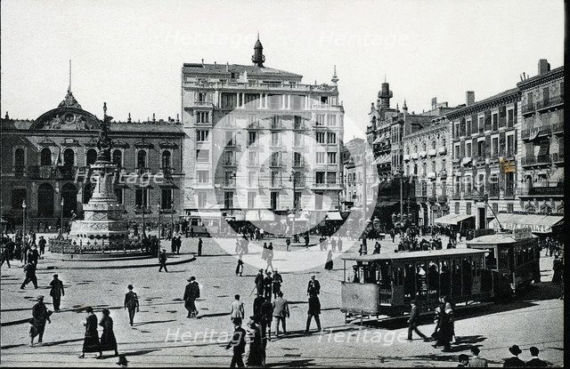 Electric Tram with trailer load circulating through the Plaza of the Constitution of Zaragoza (Ar…