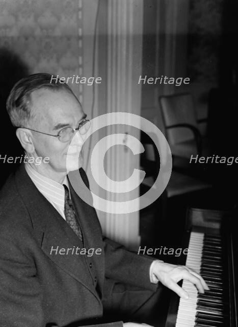 Portrait of Roy J. Carew in his home, 818 Quintana Place NW, Washington, D.C., ca. Feb. 1942. Creator: William Paul Gottlieb.
