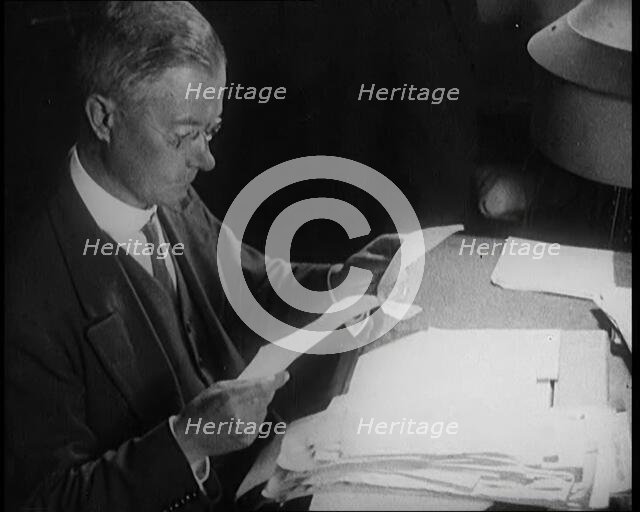 Journalist at Work Reading Notes, 1921. Creator: British Pathe Ltd.
