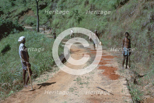 Primitive road-repairs in Sri Lanka. Artist: CM Dixon Artist: Unknown