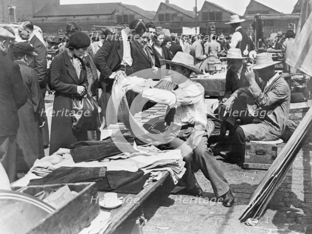 A market stall in Caledonian Market, Islington, London, 1930s. Artist: John H Stone