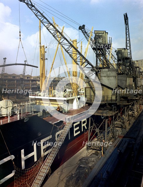 The 'Manchester Renown' being loaded with steel for export, Manchester, 1964.  Artist: Michael Walters