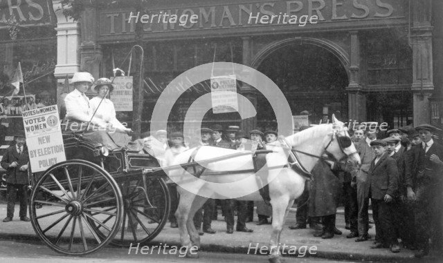 A 'press cart' outside the Woman's Press, Charing Cross Road, London, July 1911. Artist: Unknown