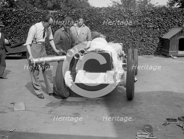Working on Raymond Mays' Vauxhall-Villiers, c1930s. Artist: Bill Brunell.
