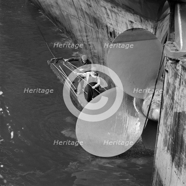 Cleaning the propellor of a ship, London Docks, September 1965. Artist: John Gay