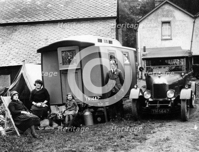 Family group with a 1925 Morris Oxford 14/28 and caravan, (Eccles, c1926?). Artist: Unknown
