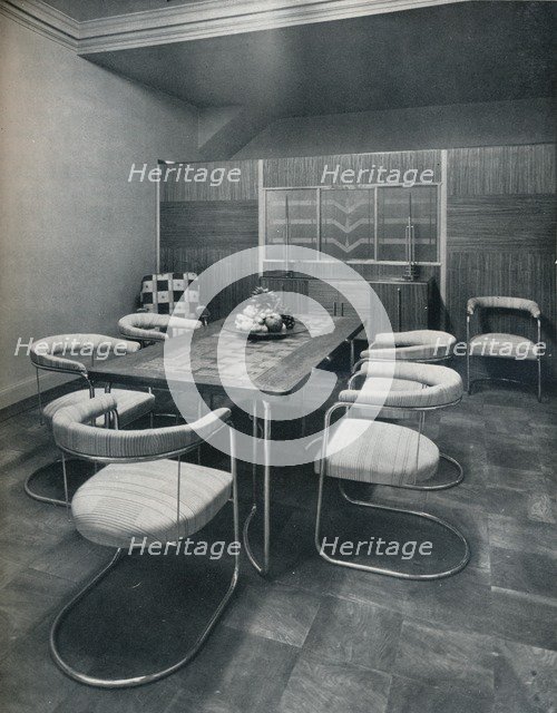 'A dining-room suite, with table and chairs of steel tube. By Practical Equipment Ltd., of London',  Artist: Unknown.