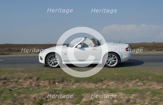 2014 Mazda MX5 Roadster Coupe Artist: Unknown.