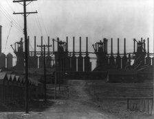 Steelmill and workers' houses, Birmingham, Alabama, 1936. Creator: Walker Evans.