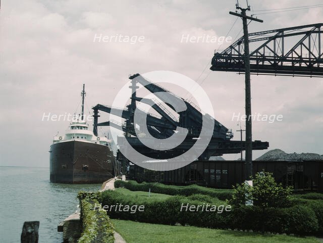 Pennsylvania R.R. [Railroad] ore docks, unloading iron ore from a lake..., Cleveland, Ohio, 1943. Creator: Jack Delano.