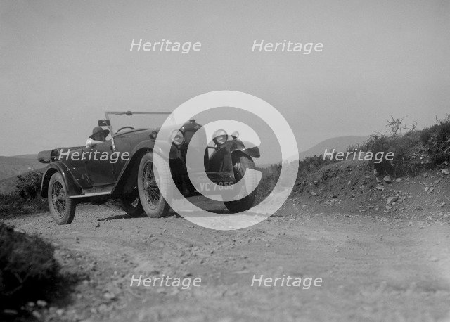 Kitty Brunell road testing a Riley 9 WD tourer, c1930. Artist: Bill Brunell.