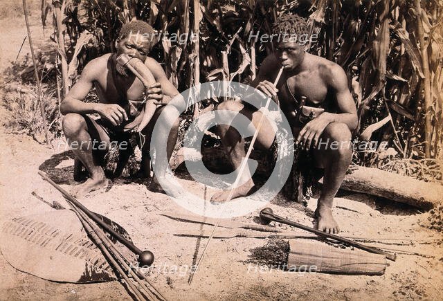 Two African men smoking pipes, 19th century. Creator: Unknown.