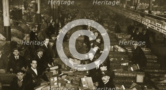Sorting parcels at the Post Office, Mount Pleasant, London, 20th century. Artist: Unknown