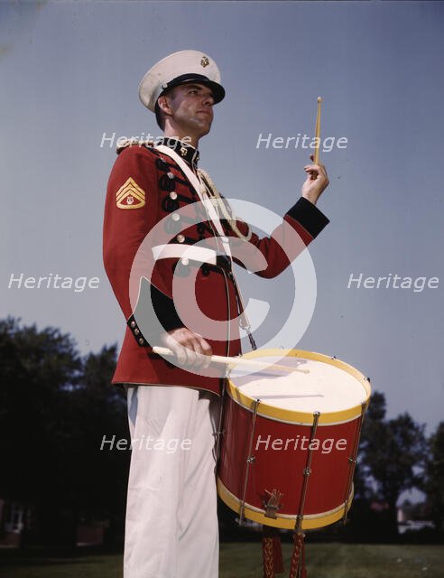 U.S. Marine Band drummer, probably at the Marine Barracks, Washington, D.C. , 1942. Creator: Alfred T Palmer.
