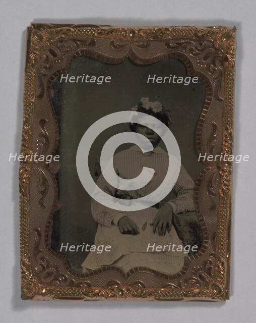 Tintype of a woman wearing a striped dress with flowers in her hair, 1855-1860s. Creator: Unknown.