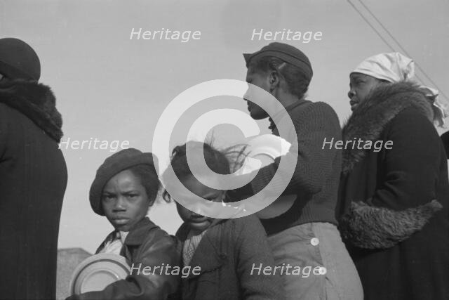 Possibly: Negroes in the lineup for food at meal time at the camp..., Forrest City, Arkansas, 1937. Creator: Walker Evans.