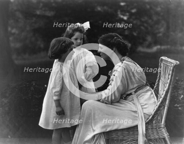 Mrs. Frank Vanderlip seated on porch, with two children, not after 1913. Creator: Frances Benjamin Johnston.