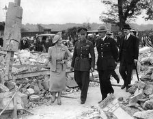 Queen Elizabeth and King George VI inspecting air raid damage, World War II, 1940-1945. Artist: Unknown