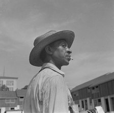 Negro waterboy for a housing construction gang, Washington, D.C., 1942. Creator: Gordon Parks.