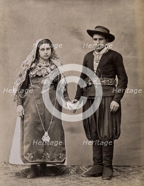People of Leon, a man and woman holding hands, wearing traditional dress, c1880. Creator: Juan Laurent.