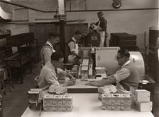 Men wrapping Rowntree's Fruit Gums and packing into boxes, Rowntree factory, York, Yorkshire, 1955. Artist: Unknown