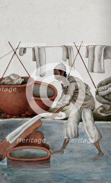 Delhi: a washerman washing clothes, (between 1800 and 1899?). Creator: Unknown.